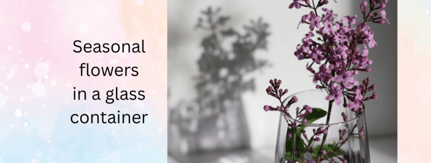 photo of seasonal flowers in a glass vase